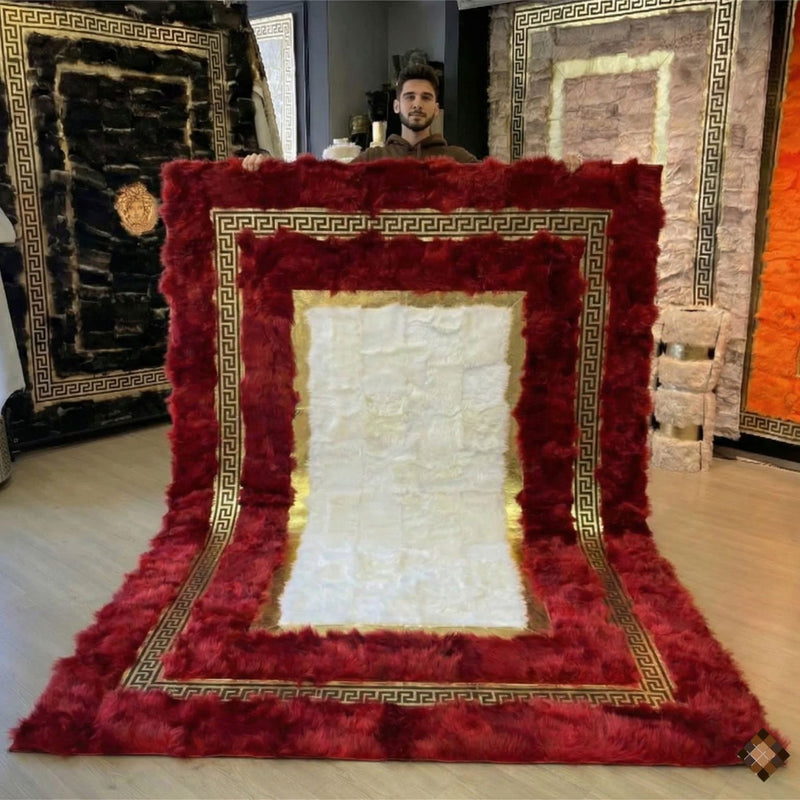 A genuine handmade sheepskin area rug with rich red tones and gold Greek key detail. Soft, luxurious, and custom-made for elegant interiors.