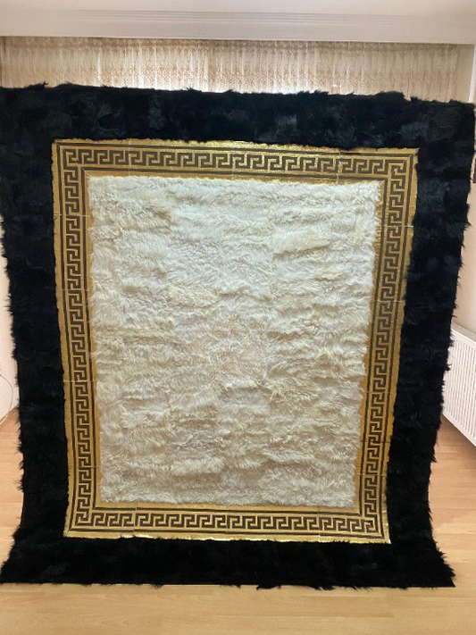 Natural black and white handmade sheepskin rug with decorative golden border for bedroom decor