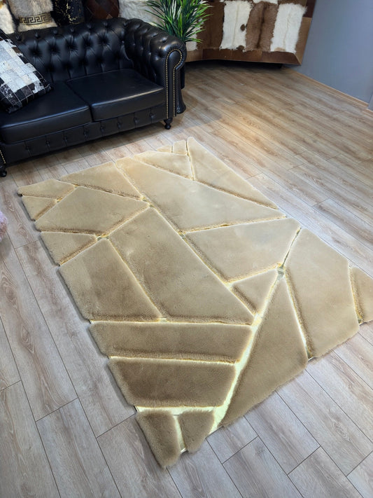 Luxury ultra soft gold faux fur area rug with geometric design on wooden floor in living room