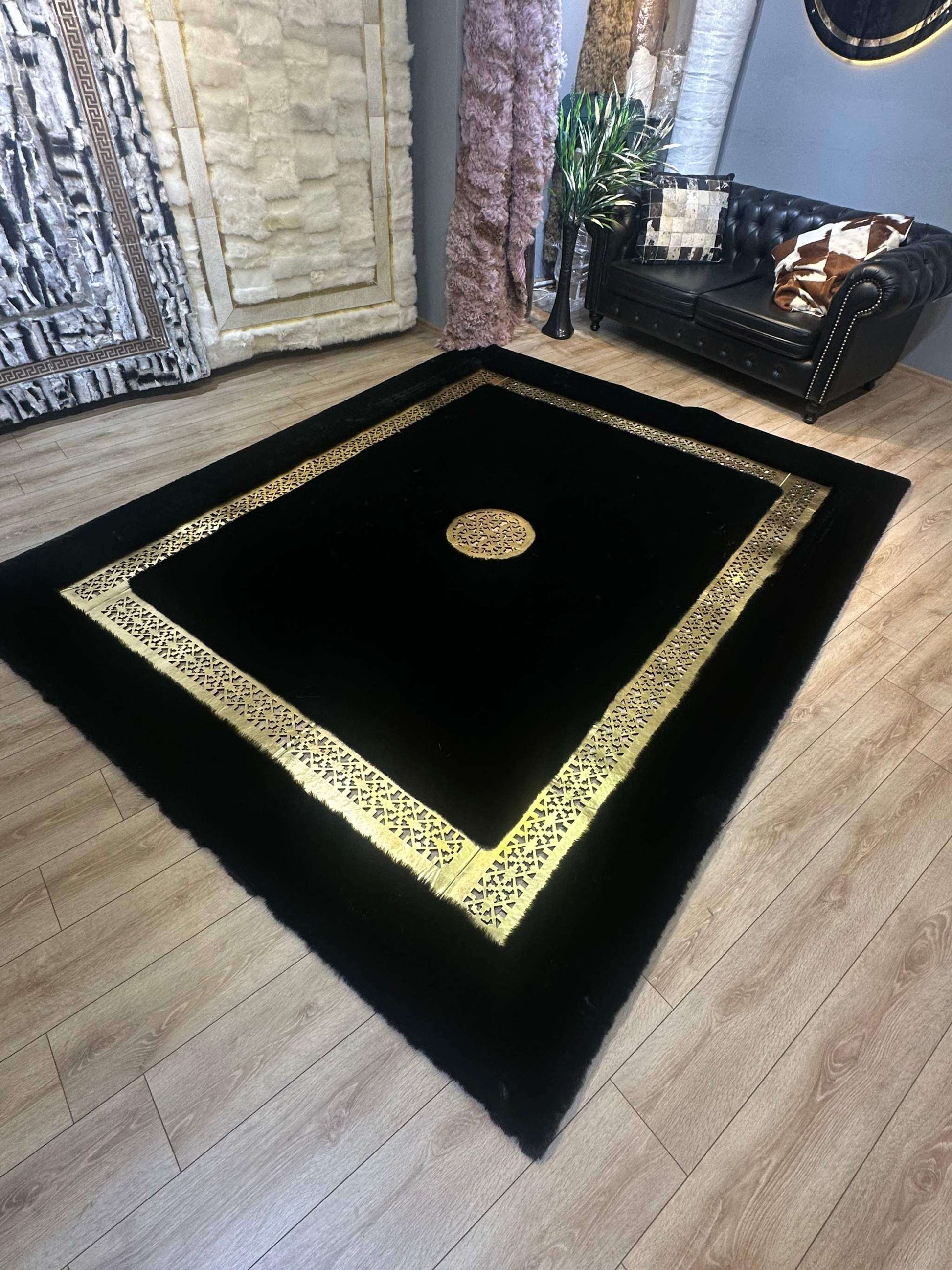 Unique modern handmade black gold faux fur rug in stylish living room setting