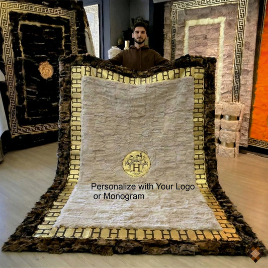 Handmade genuine sheepskin rug with custom logo or initials. Gold border detail, made to order in bespoke sizes for a refined, luxury statement.