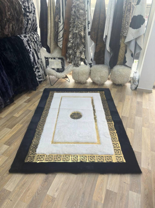 Elegant modern handmade black white gold faux fur living room rug with fluffy soft texture on wooden floor