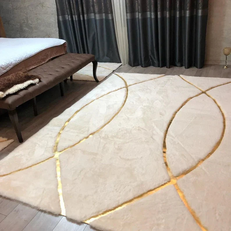 Luxury white and gold fluffy plush rug with gold accents in a bedroom setting