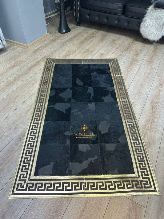 Gold and black cowhide rug with Greek key pattern on hardwood floor