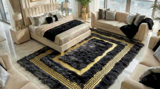 Handmade sheepskin patchwork rug placed under a queen bed     with warm neutral bedding and wood flooring