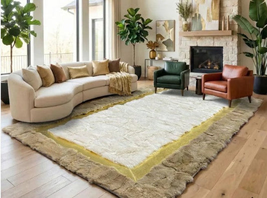 Soft rabbit fur rug placed beside a bed on warm wood     flooring in a neutral bedroom with upholstered headboard