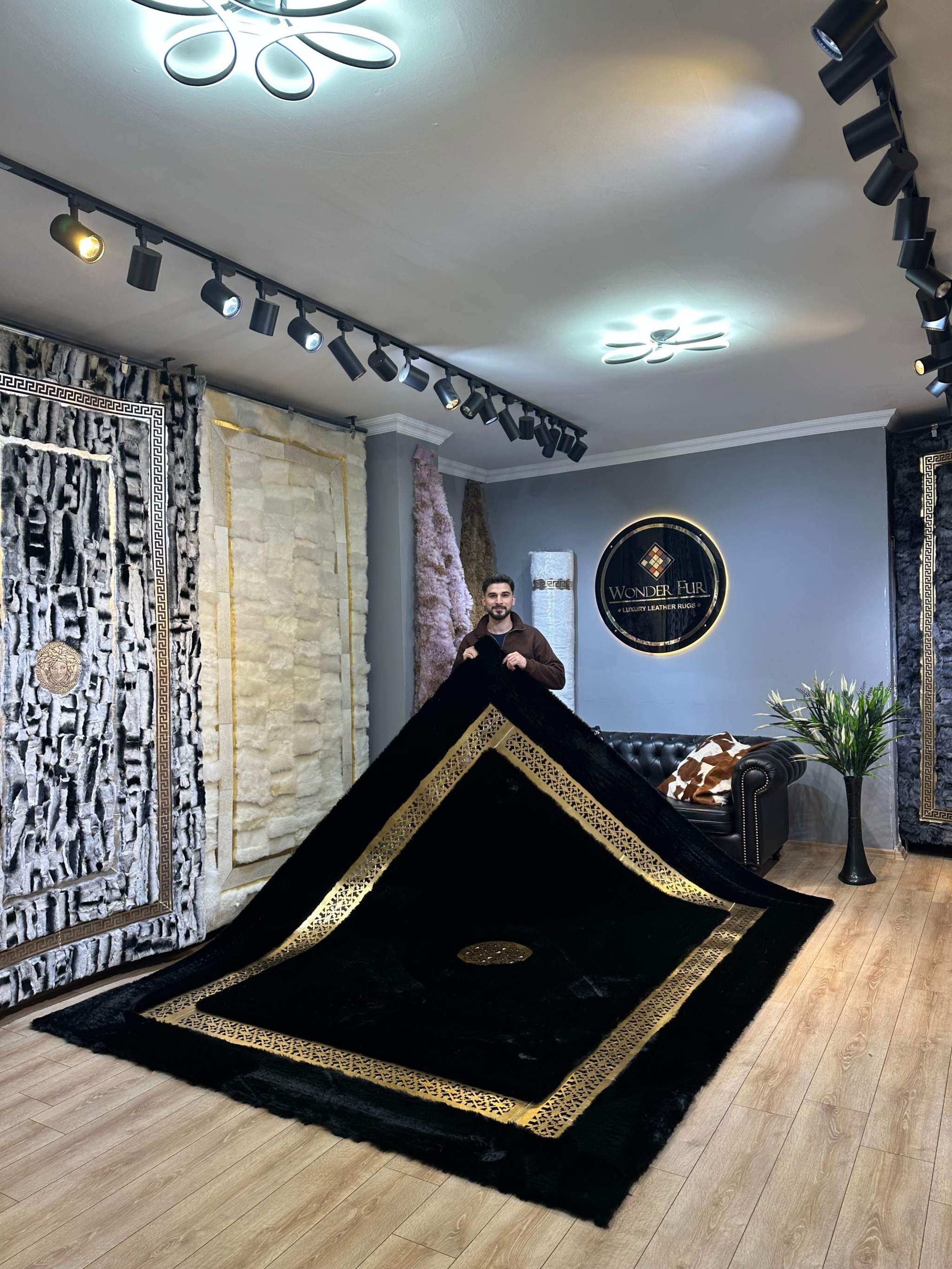 plush black gold area rug placed under a coffee table in a modern interior