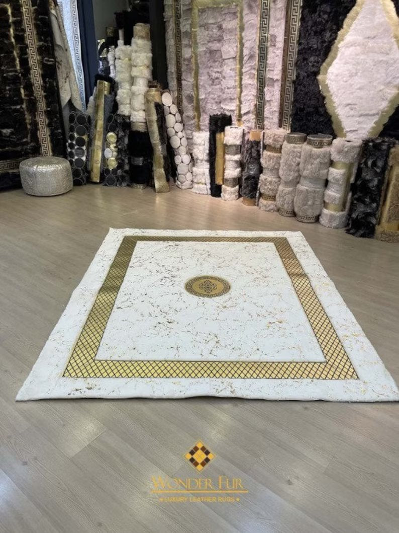 Luxury handmade plush rug in white and gold featuring a geometric border and elegant central medallion design.