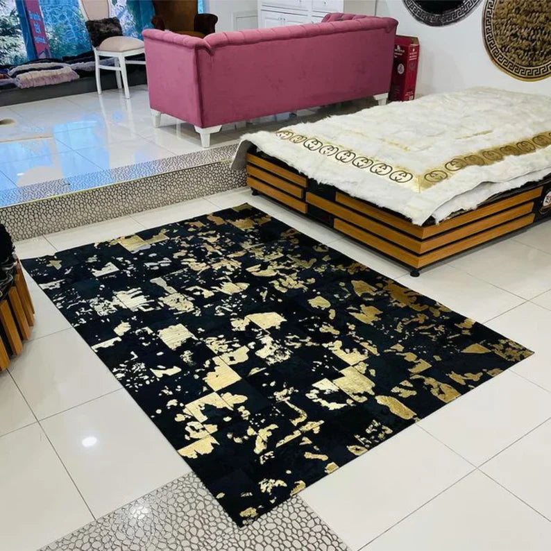 Luxury black and gold natural cowhide area rug in modern living room setting