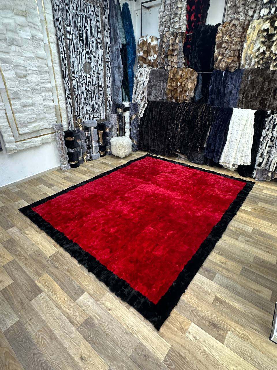 Handmade red and black natural soft rabbit fur rug in modern room setting